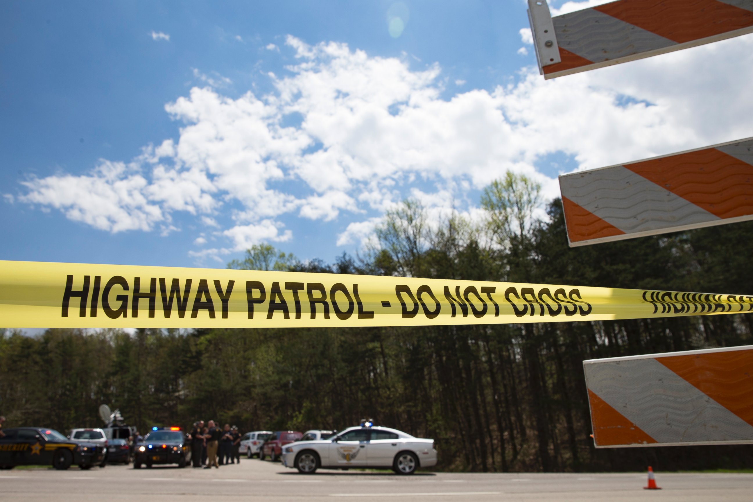PHOTO: Police tape is deployed across from the Union Hill Road exit off Route 32 at a crime scene perimeter, April 22, 2016, in Pike County, Ohio. 