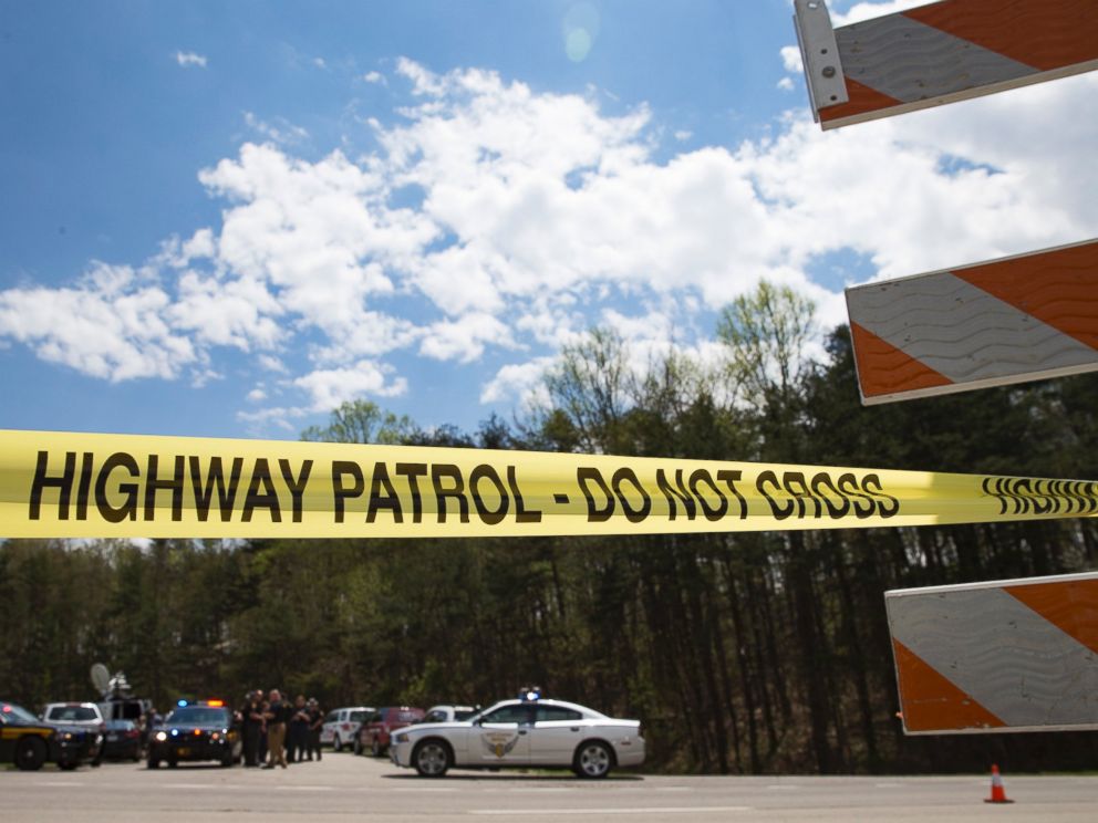 PHOTO: Police tape is deployed across from the Union Hill Road exit off Route 32 at a crime scene perimeter, April 22, 2016, in Pike County, Ohio.