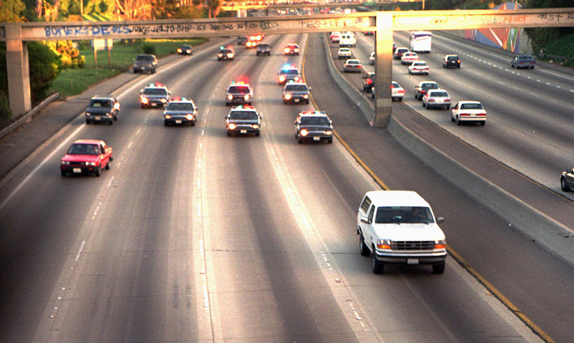 PHOTO: In this June 17, 1994 file photo, a white Ford Bronco, driven by Al Cowlings carrying O.J. Simpson, is trailed by Los Angeles police cars as it travels on a Southern California freeway in Los Angeles. 