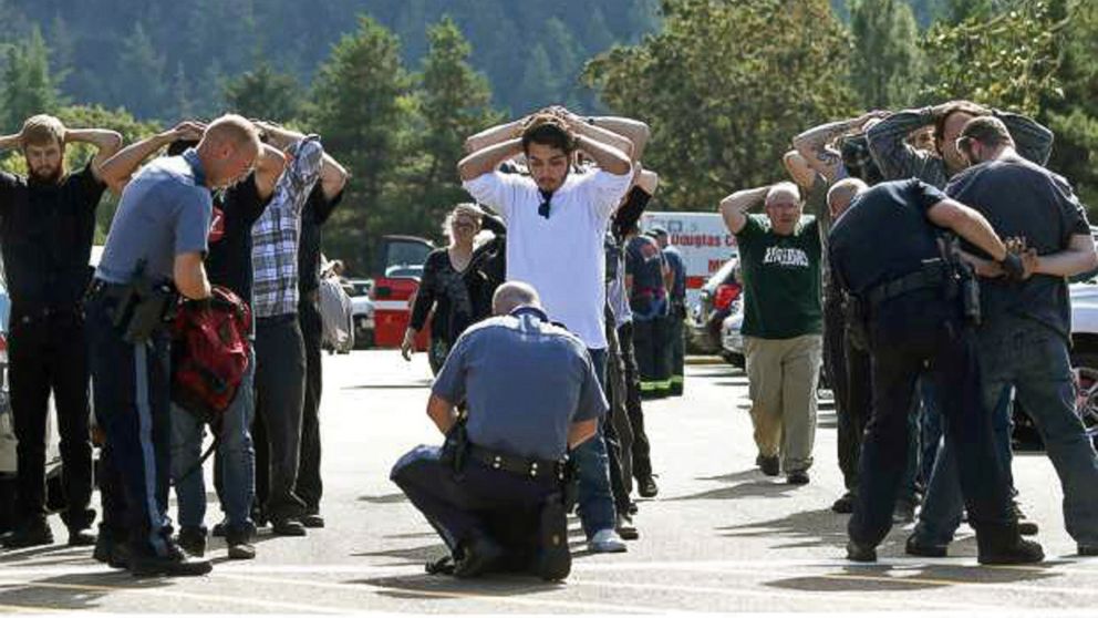 PHOTO: Police search students outside Umpqua Community College in Roseburg, Ore., Oct. 1, 2015, following a deadly shooting at the college.
