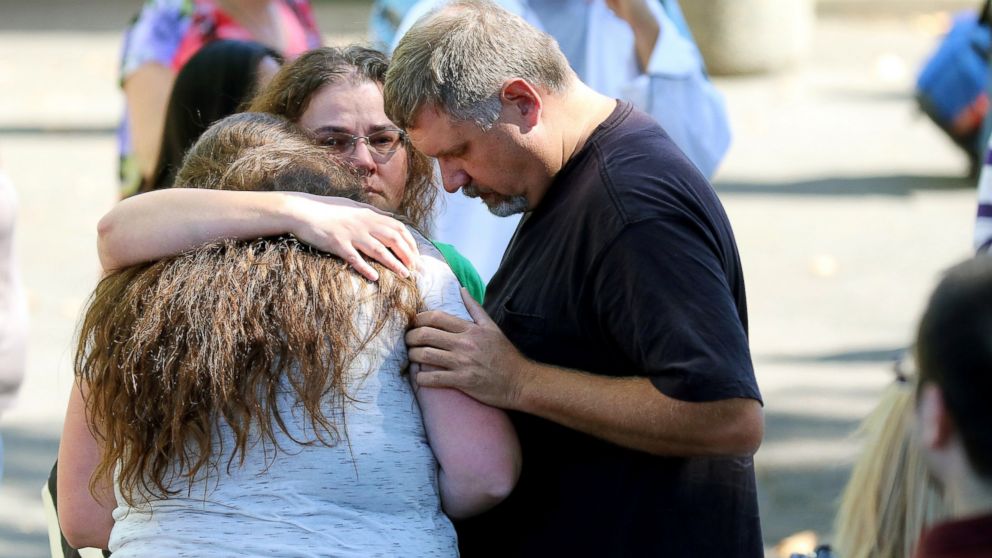 Friends and family are reunited with students at the local fairgrounds after a deadly shooting at Umpqua Community College, in Roseburg, Ore., Oct. 1, 2015.