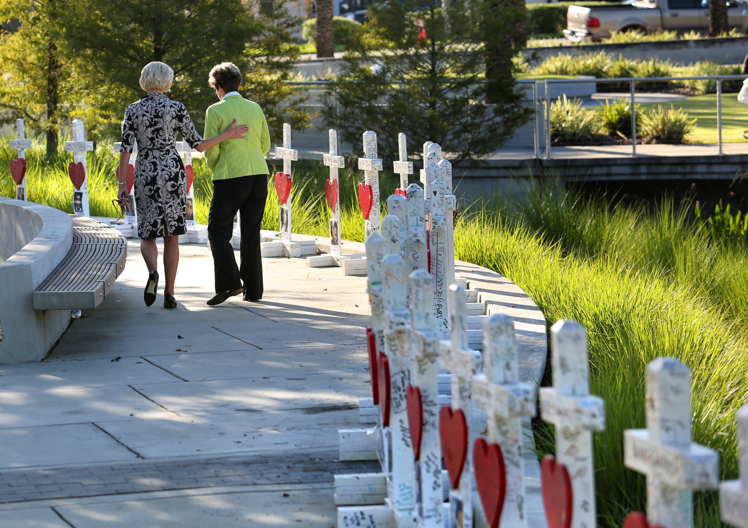 PHOTO: Orlando city commissioner Patty Sheehan, right, and a friend take a last look at crosses honoring the 49 victims, before they were transferred to the Orange County Regional History Center, July 12, 2016. 