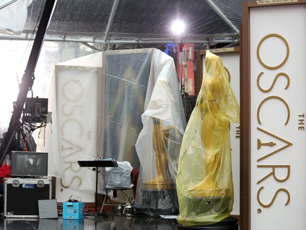 PHOTO: A pair of Oscar statues are seen on the red carpet as preparations are made during rainy weather for the 86th Academy Awards in Los Angeles, Friday, Feb. 28, 2014.