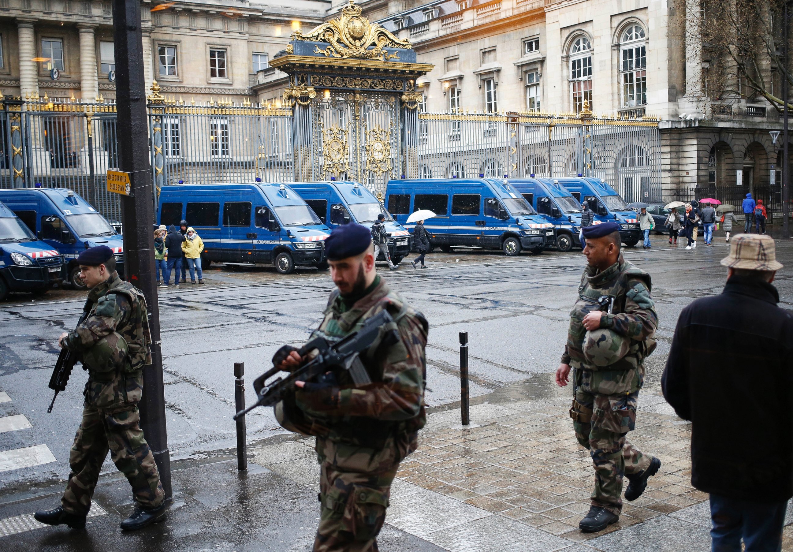 PHOTO: French soldiers patrol outside the Paris hall of Justice, March 30, 2016, while Frenchman Reda Kriket is being questioned by a magistrate.