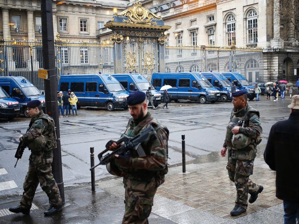 PHOTO: French soldiers patrol outside the Paris hall of Justice, March 30, 2016, while Frenchman Reda Kriket is being questioned by a magistrate.