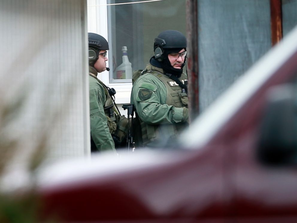 PHOTO: Police stand near the scene of a shooting, Dec. 15, 2014, in Souderton, Pa.