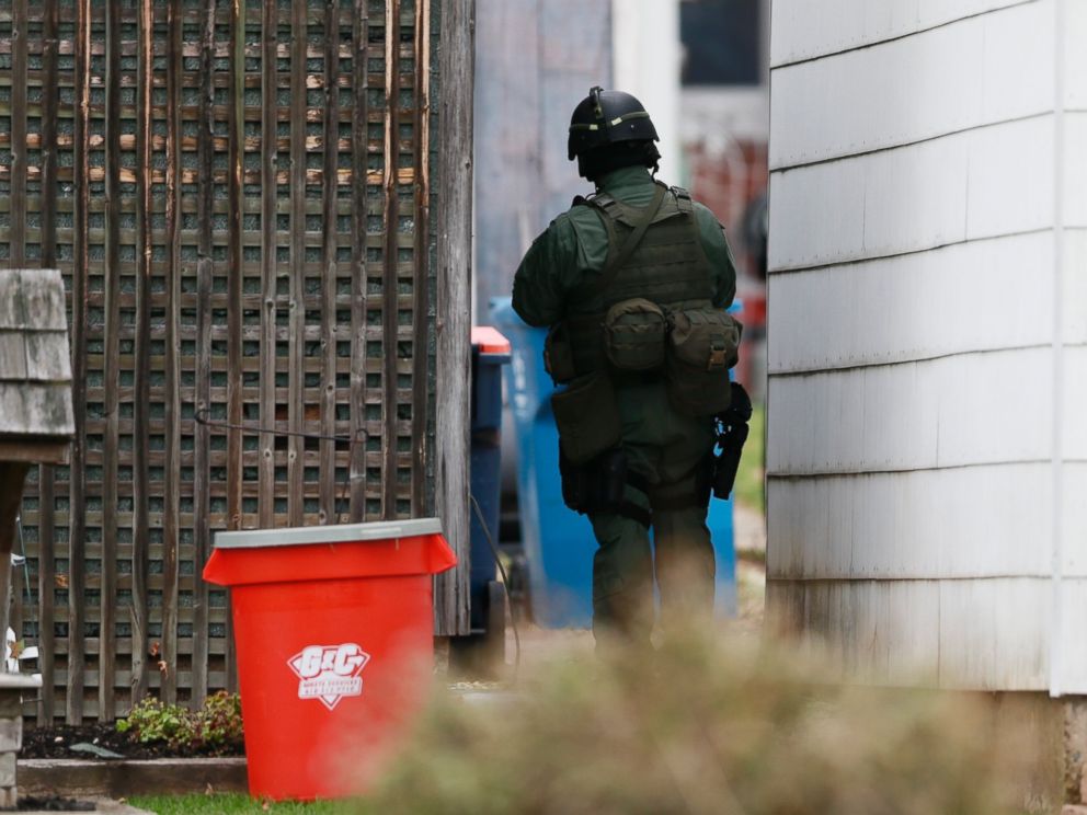PHOTO: A police officer stands near the scene of a shooting
