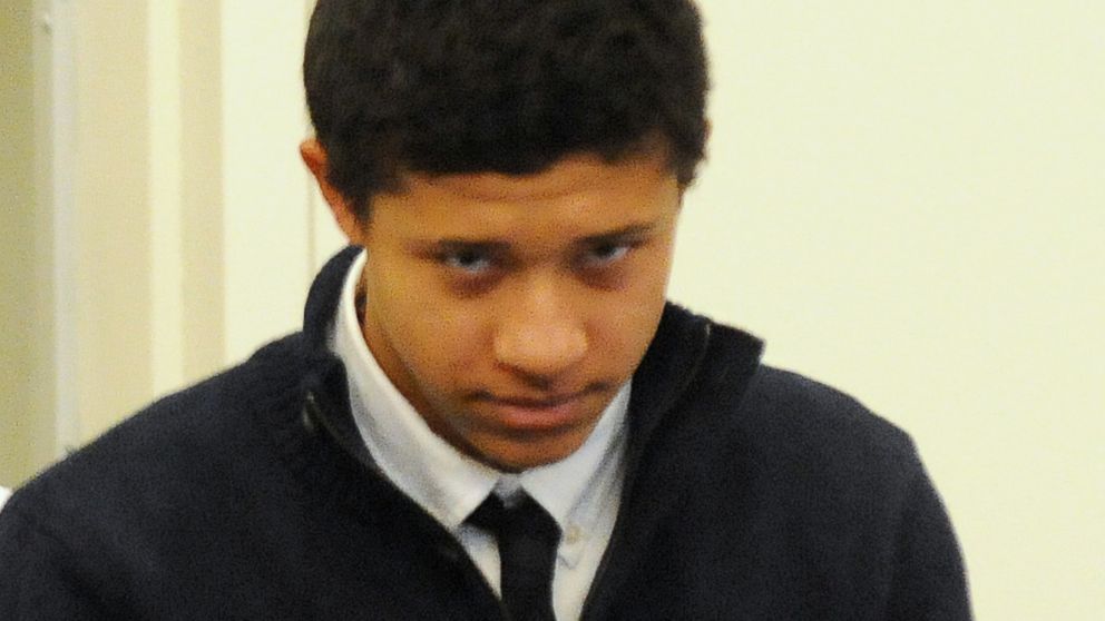 Phillip Chism is lead into the court room at his arraignment in Salem Superior Court, Dec. 4, 2013, in Salem, Mass.