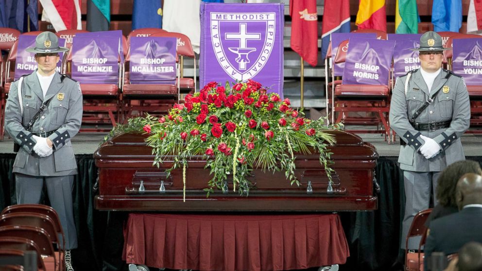 A South Carolina Highway Patrol honor guard stands next to the casket of Sen. Clementa Pinckney before his funeral service, June 26, 2015, in Charleston, S.C.