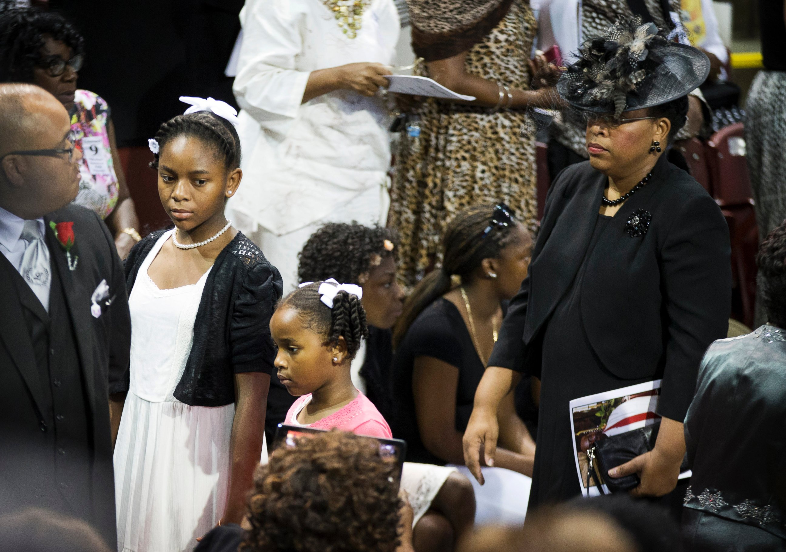 PHOTO: Sen. Clementa Pinckney's wife Jennifer Pinckney, right, and daughters Eliana, left, and Malana walk in for his funeral service, June 26, 2015, in Charleston, S.C. 