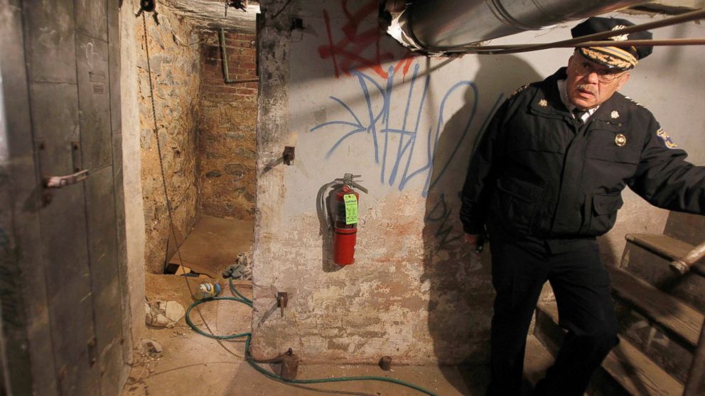PHOTO: Police Commissioner Charles Ramsey stands by the entrance to the dank basement room in Philadelphia where four weak and malnourished mentally disabled adults were found locked inside, Oct. 17, 2011. 