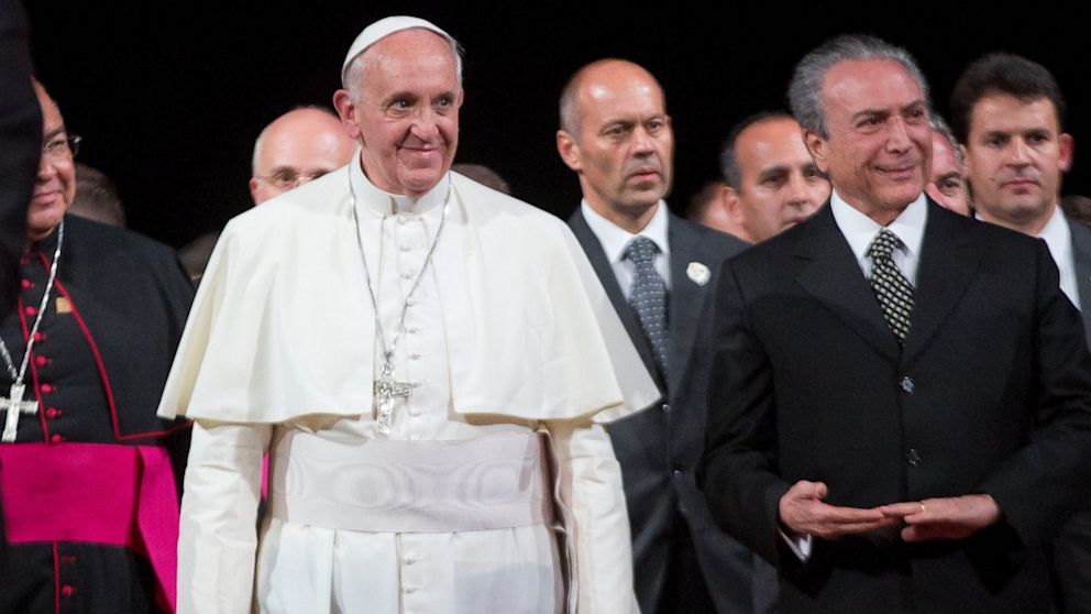 Pope Francis, accompanying Brazilian Vice President Michel Temer, right, attends a farewell ceremony at the Rio de Janeiro airport in Rio de Janeiro, Brazil,  July 28, 2013. 