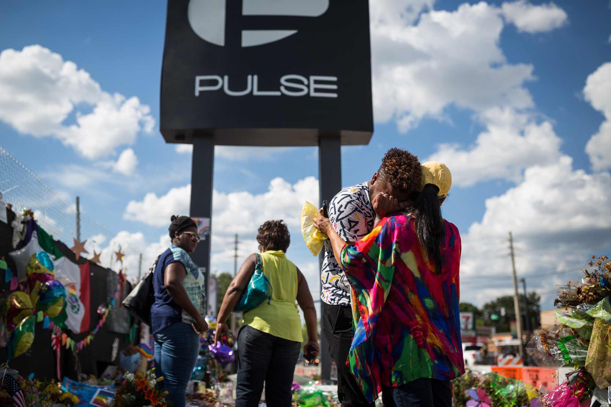 PHOTO: Wayne Dominici, 23, cries on the shoulder of his aunt, Ada Dominici, July 12, 2016, at a memorial outside Pulse, the gay nightclub where a shooter killed 49 people in Orlando, Florida.