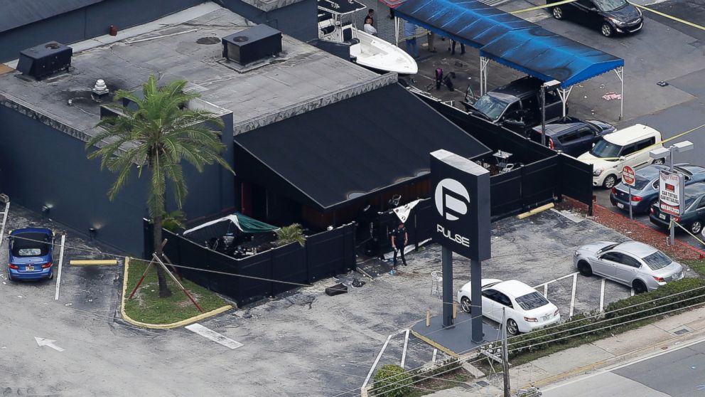 PHOTO: Law enforcement officials work at the Pulse Orlando nightclub following a fatal shooting in Orlando, Fla., June 12, 2016. 