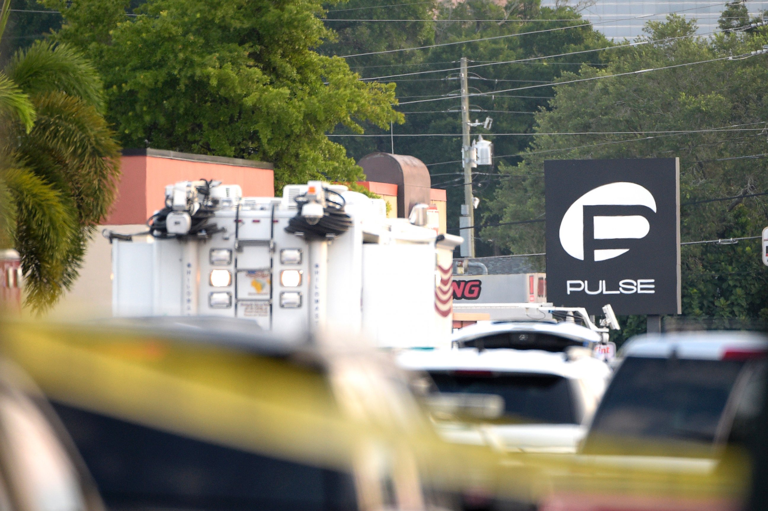 PHOTO: Police cars and emergency vehicles surround the Pulse Orlando nightclub, the scene of a fatal shooting, in Orlando, Fla., June 12, 2016. 