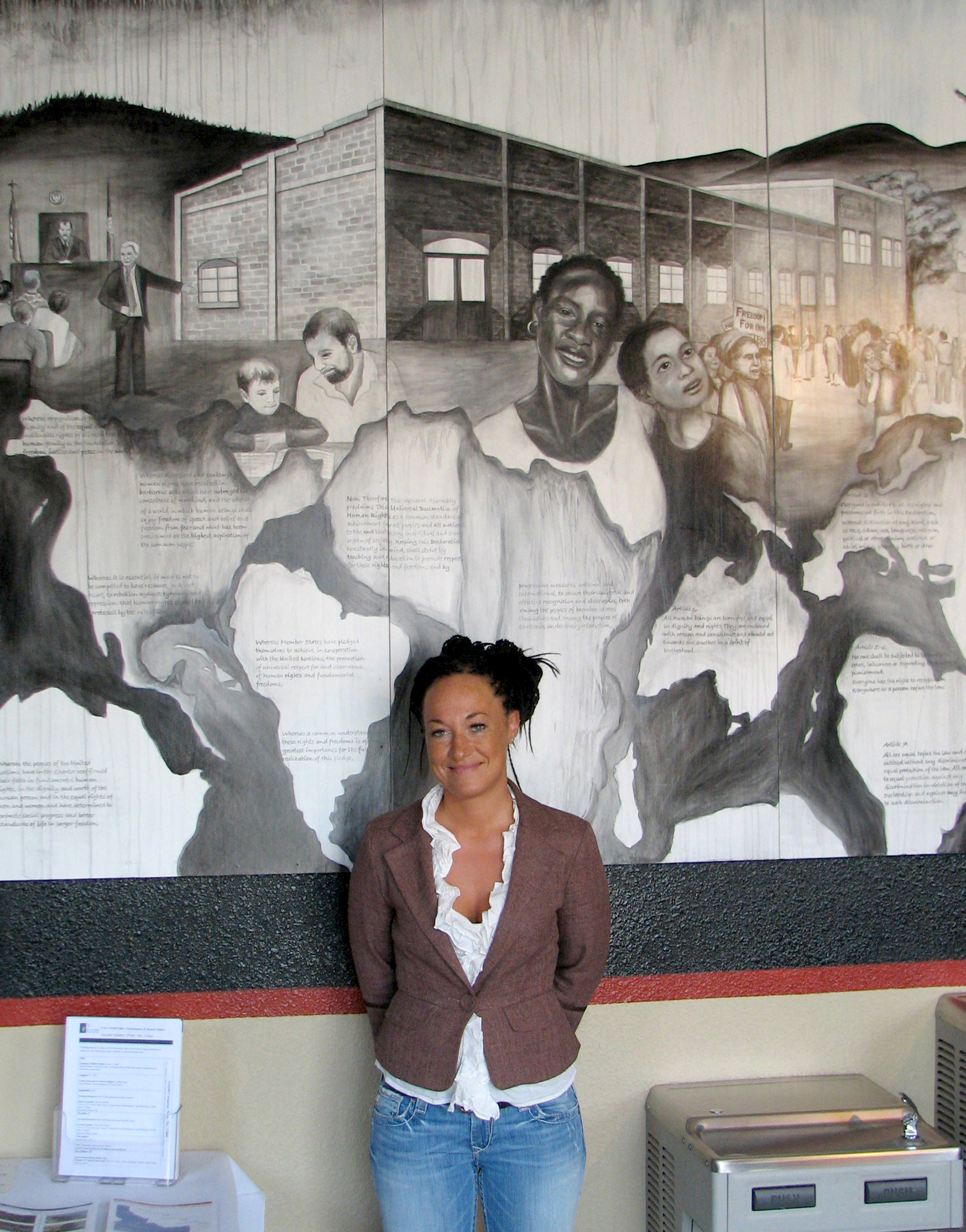 PHOTO: Rachel Dolezal, a leader of the Human Rights Education Institute, stands in front of a mural she painted at the institute's offices in Coeur d'Alene, Idaho, July 24, 2009.