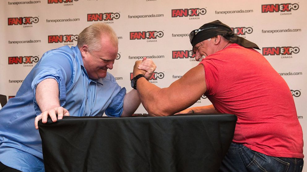 Toronto City Mayor Rob Ford, left, takes on professional wrestler Hulk Hogan in an arm-wrestling match to promote Fan Expo in Toronto on Friday, Aug. 23, 2013 . 
