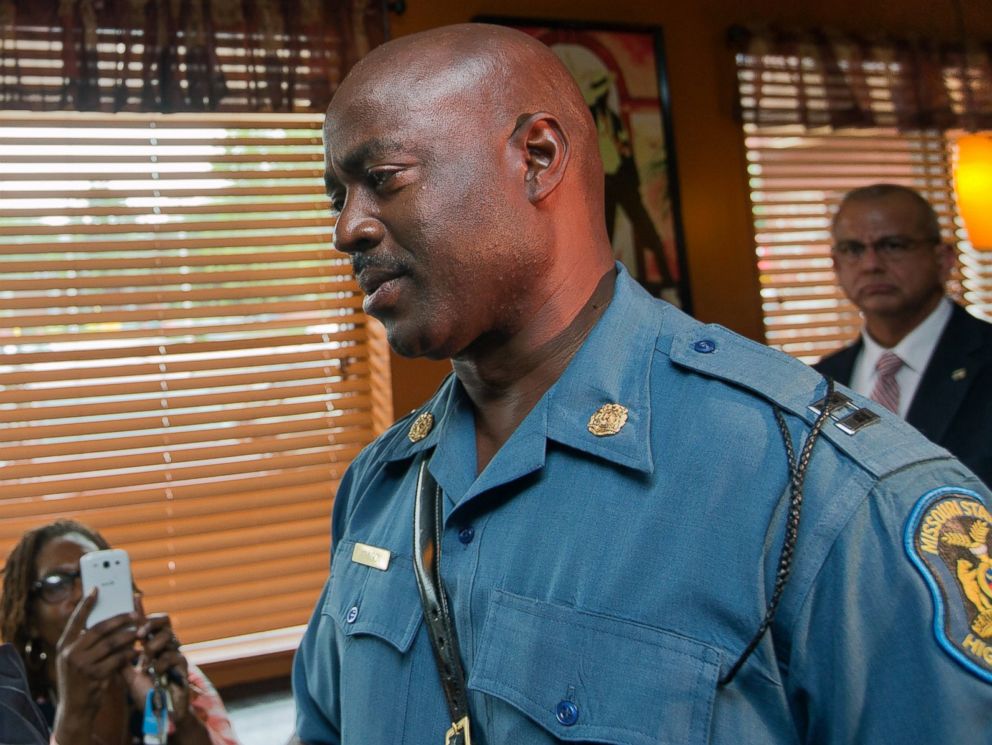 PHOTO: Attorney General Eric Holder speaks with Capt. Ron Johnson of the Missouri State Highway Patrol at Drakes Place Restaurant in Ferguson, Mo., in this Aug. 20 2014 file-pool photo.
