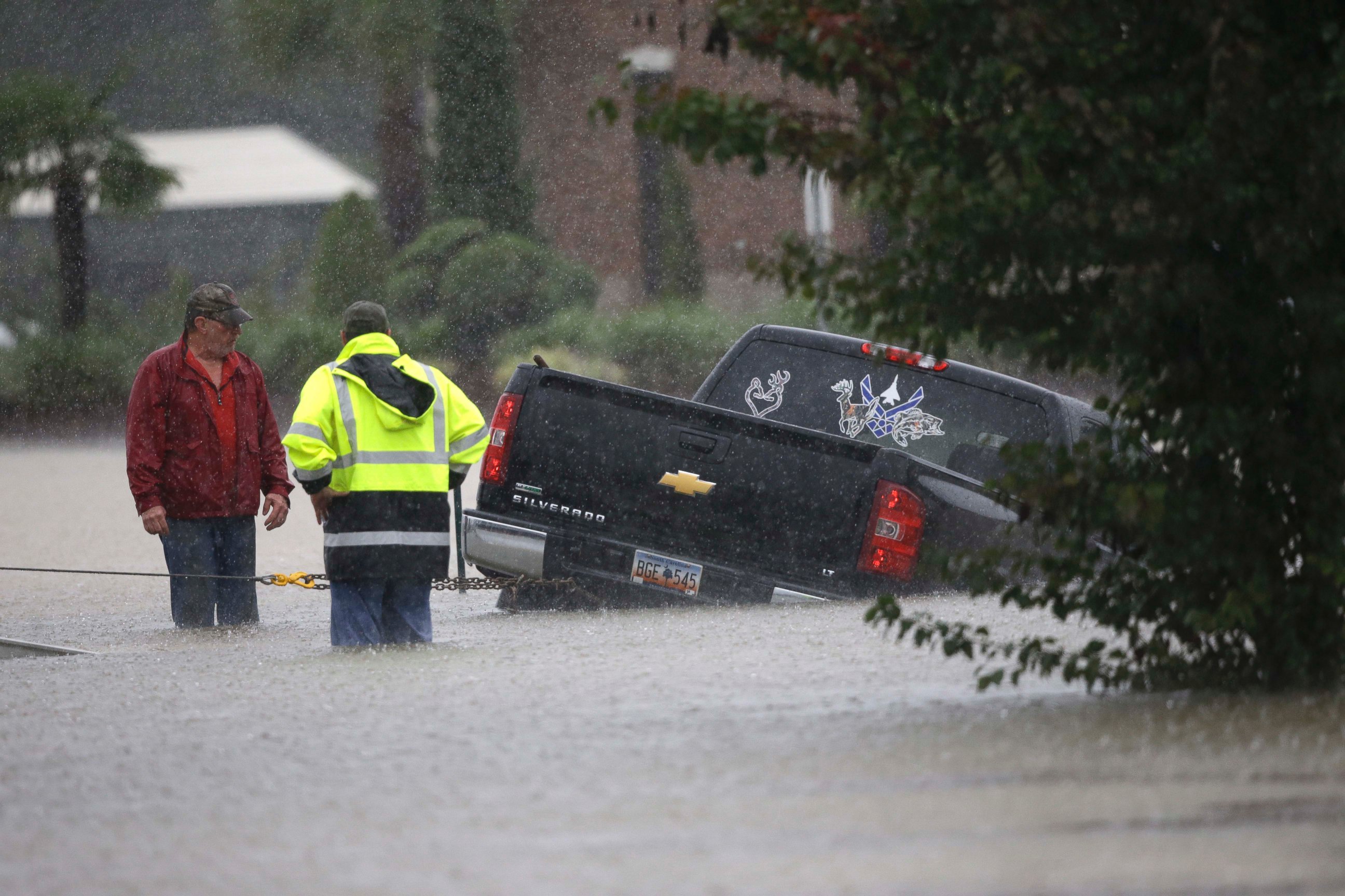PHOTO: A tow-truck operator assists a stranded motorist during flash flooding in Florence, S.C.,  Oct. 4, 2015, as heavy rain continues to cause widespread flooding in the state.