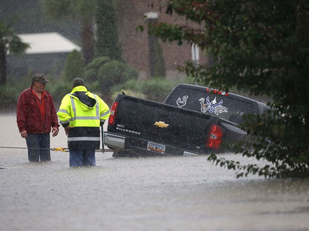 PHOTO: A tow-truck operator assists a stranded motorist during flash flooding in Florence, S.C., Oct. 4, 2015, as heavy rain continues to cause widespread flooding in the state.