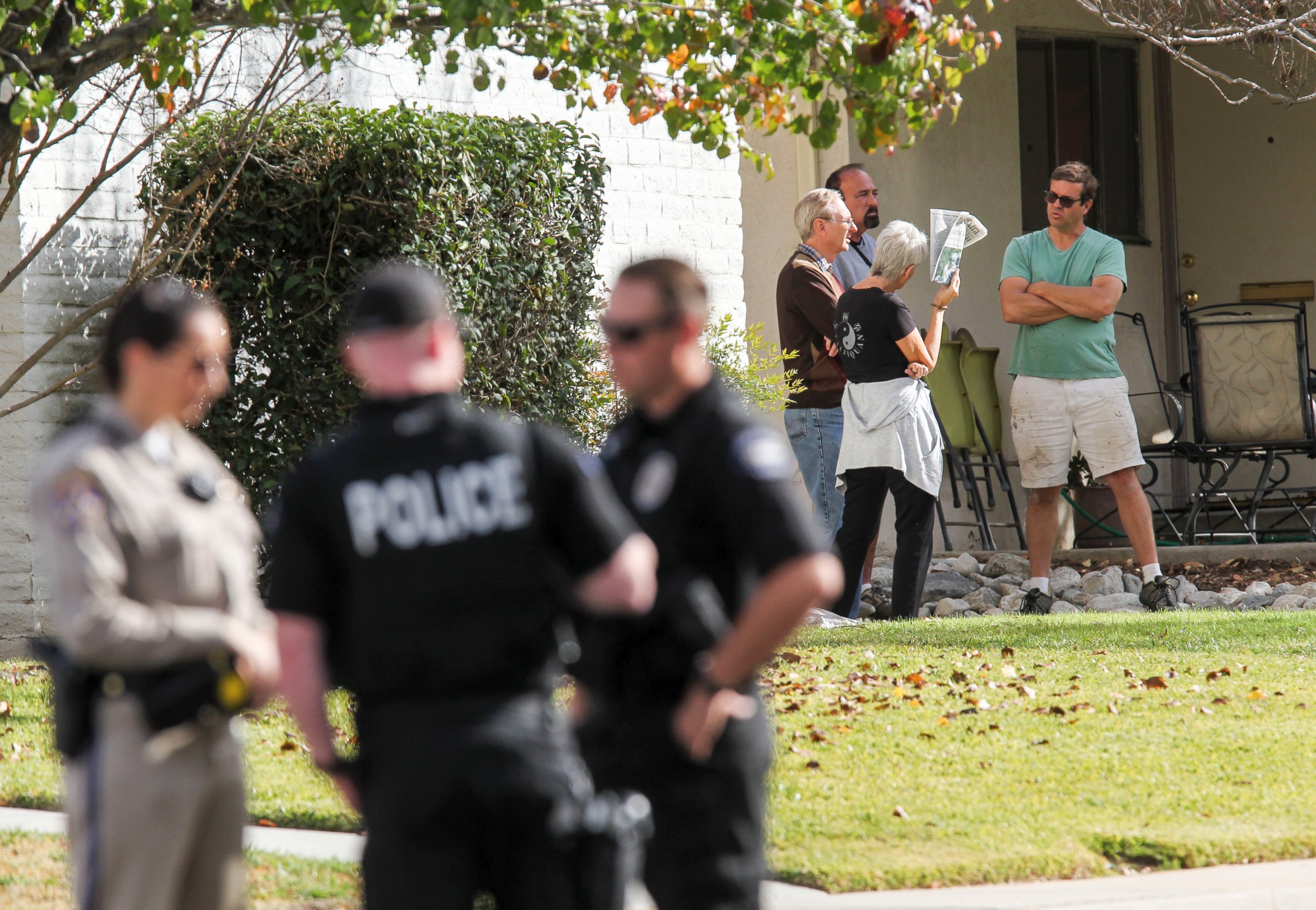 PHOTO: People gather in the neighborhood near the home in connection to the shootings in San Bernardino, Dec. 3, 2015, in Redlands, Calif.
