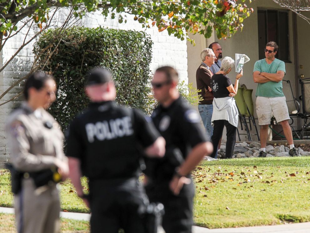 PHOTO: People gather in the neighborhood near the home in connection to the shootings in San Bernardino, Dec. 3, 2015, in Redlands, Calif.