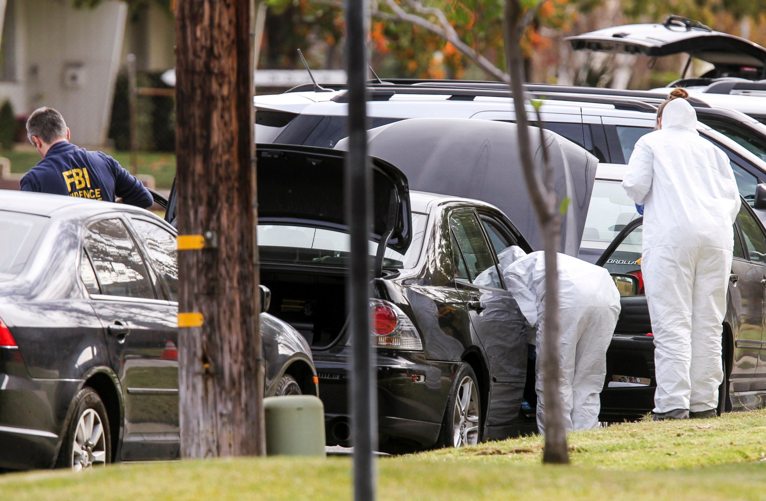 PHOTO: FBI agents investigate a car near a home in connection to the shootings in San Bernardino, Dec. 3, 2015, in Redlands, Calif. 