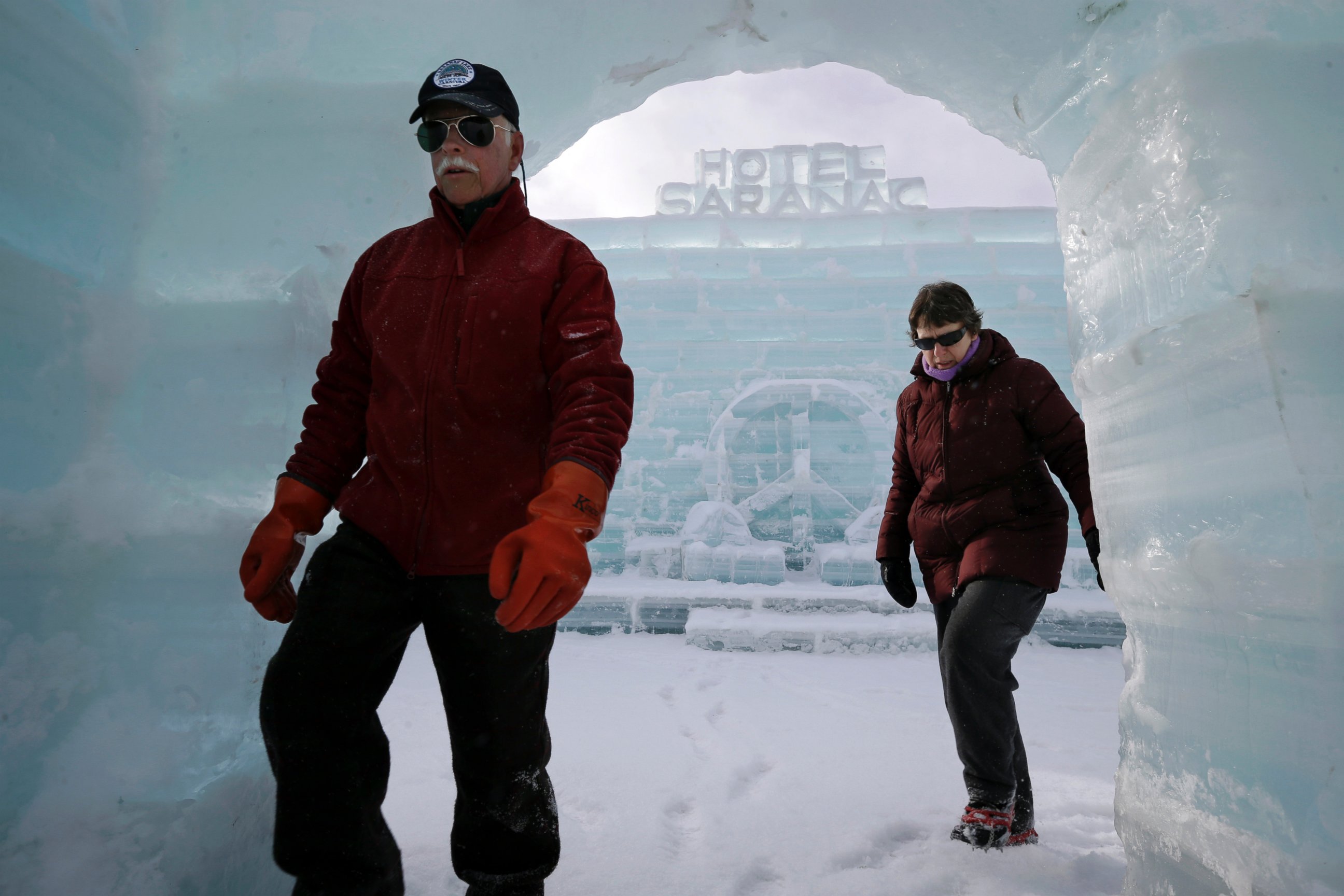 PHOTO: Dean Baker and his wife Marilynn Baker walk inside the Hotel Saranac ice palace