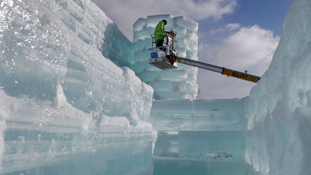 PHOTO: Volunteer John Pietras works on the Hotel Saranac ice palace in Saranac Lake, N.Y.