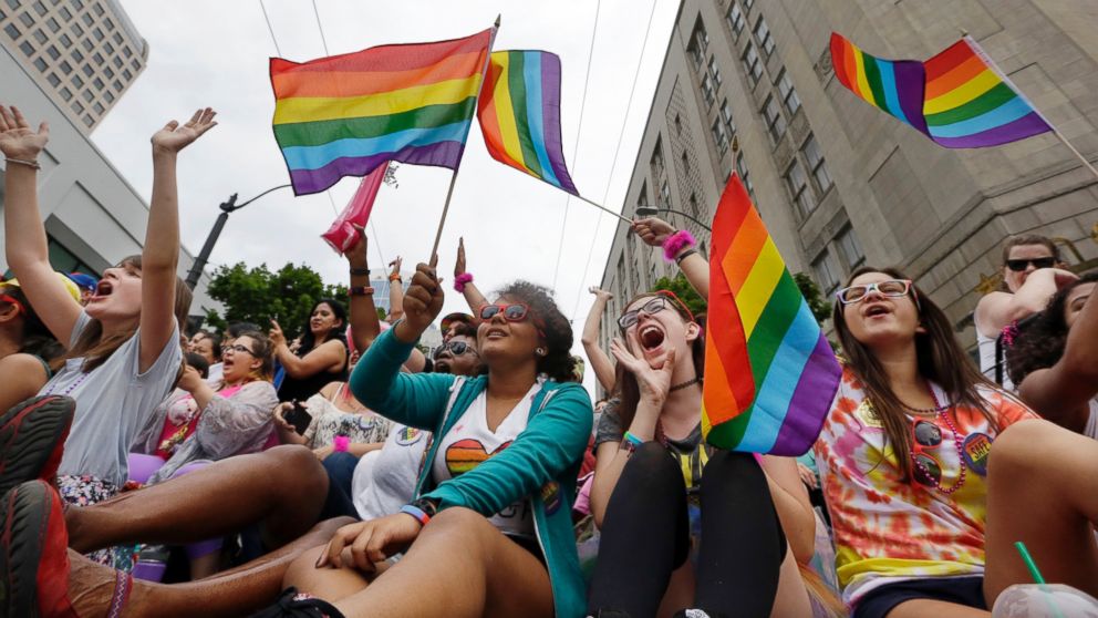Parade viewers cheer at the 41st annual Pride Parade,  June 28, 2015, in Seattle.