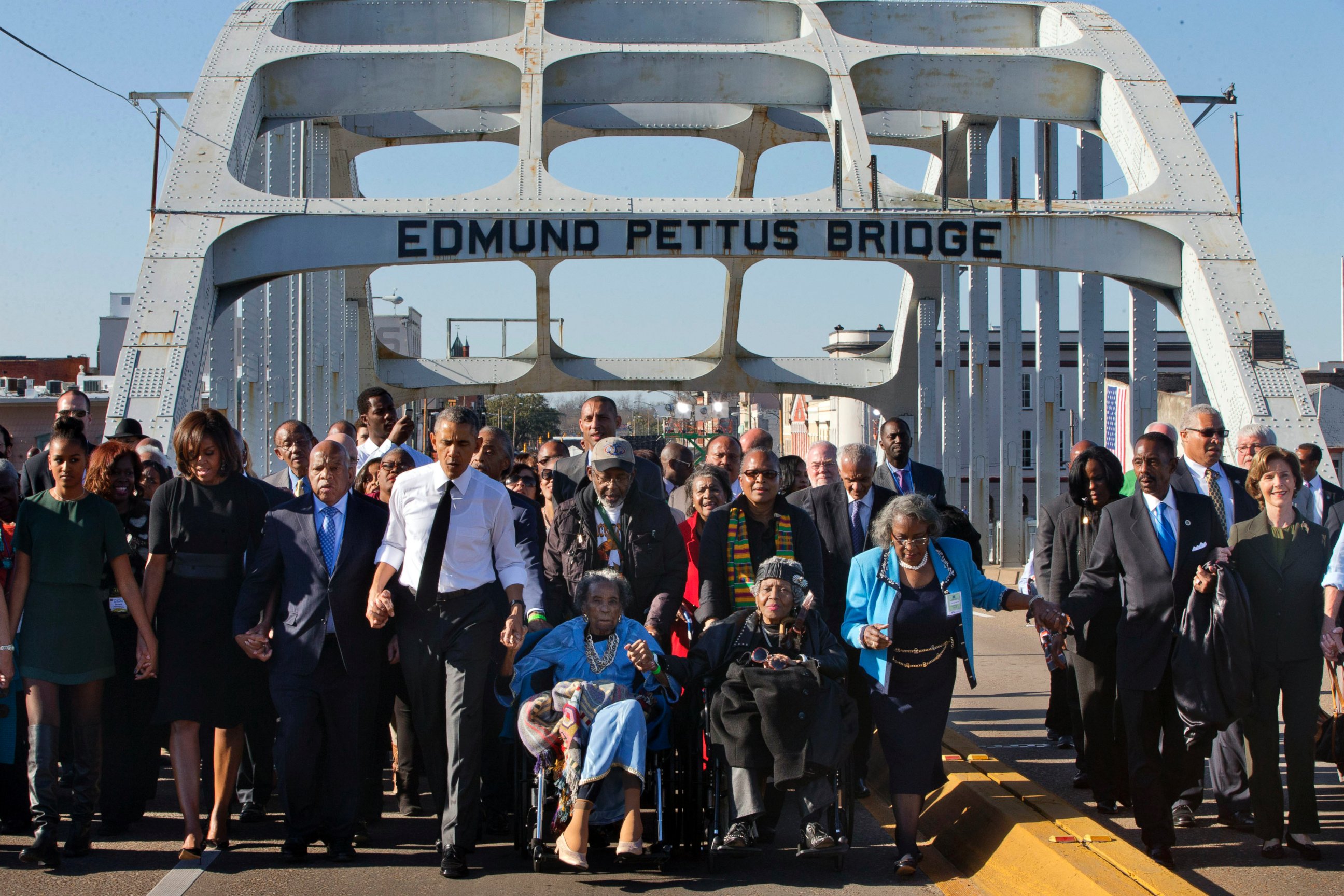 PHOTO: President Barack Obama, holding hands with Amelia Boynton, as they and the first family and others including Rep. John Lewis, D-Ga, left of Obama, walk across the Edmund Pettus Bridge in Selma, Ala. , Saturday, March 7, 2015.