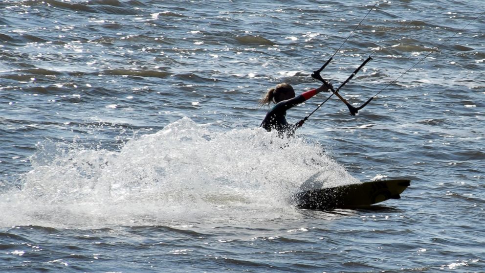 A kitesurfer enjoys the water in Cuxhaven-Doese, Germany, Sept. 25, 2016.