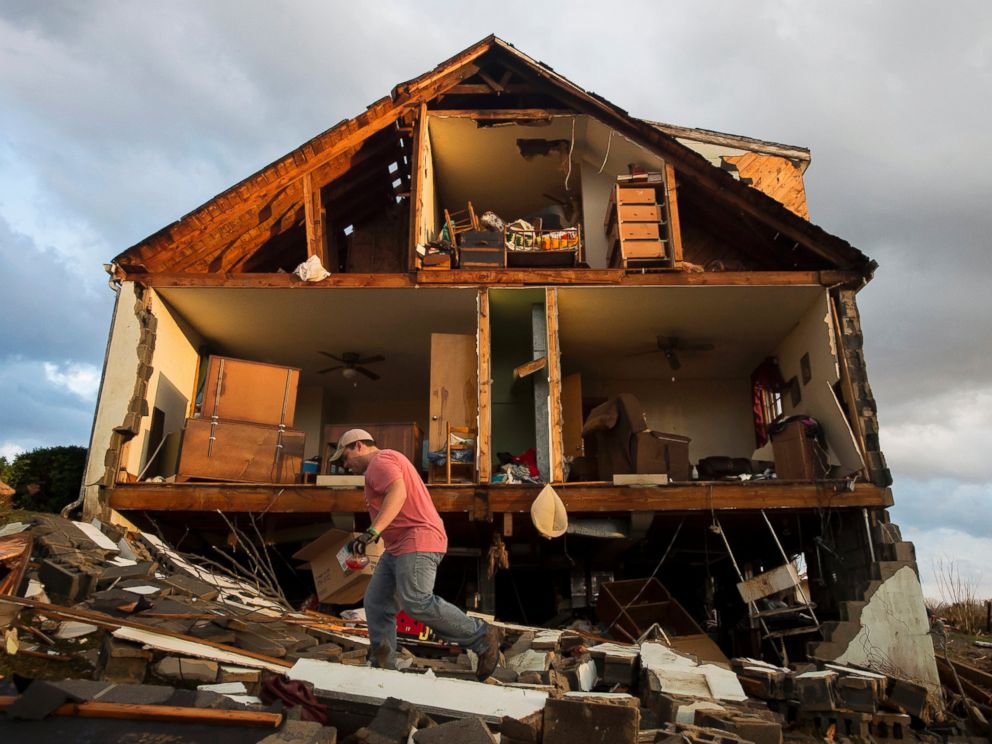 PHOTO:Nick Mobley helps clean up a house owned by a family friend, Feb. 24, 2016, after a storm hit Appomattox County, Va.