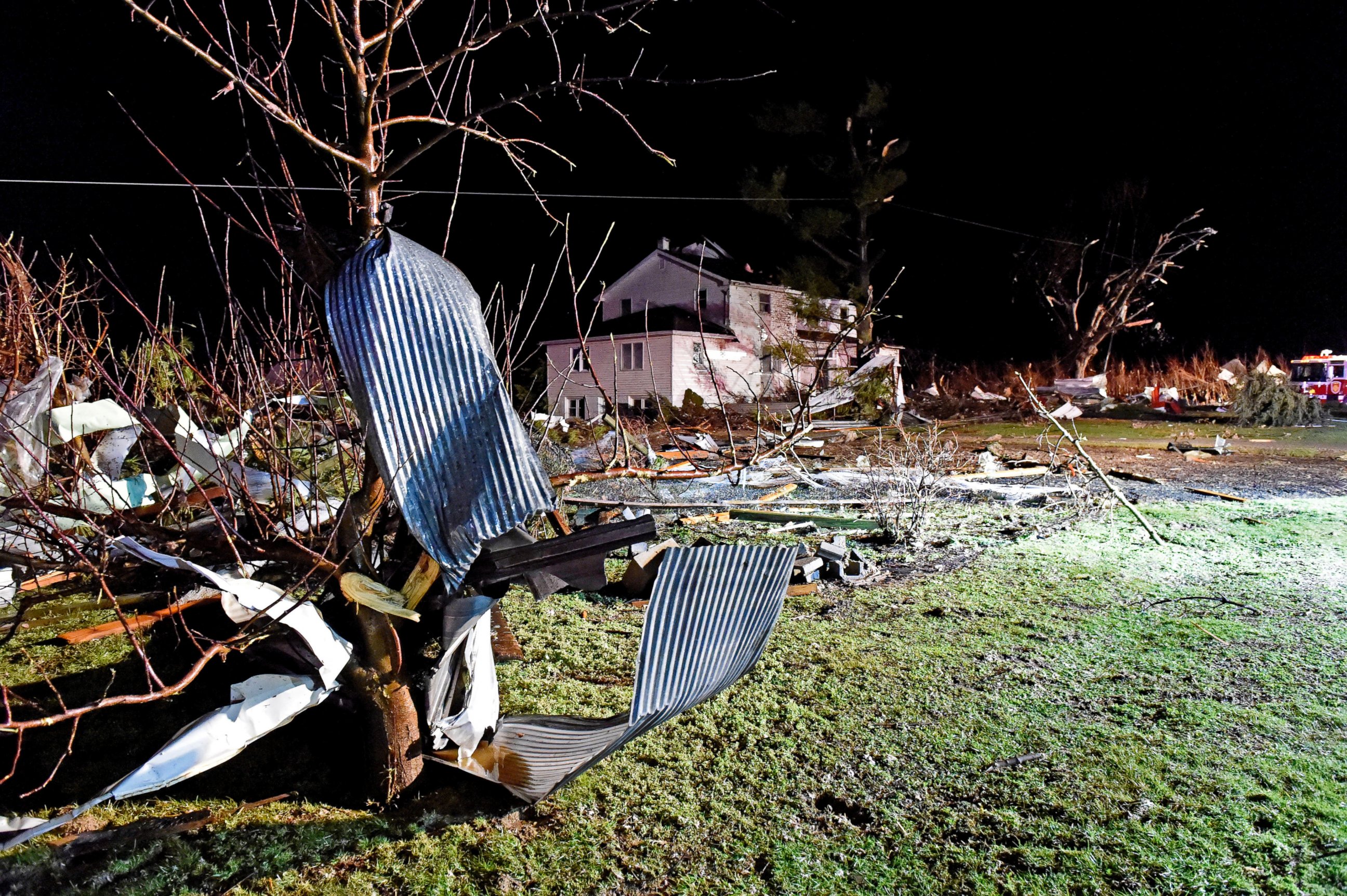 PHOTO:Debris from chicken houses that were leveled in a severe storm is strewn along Millwood Road in Gap, Pa., Feb. 24, 2016. The roof was blown off the house in the background. 