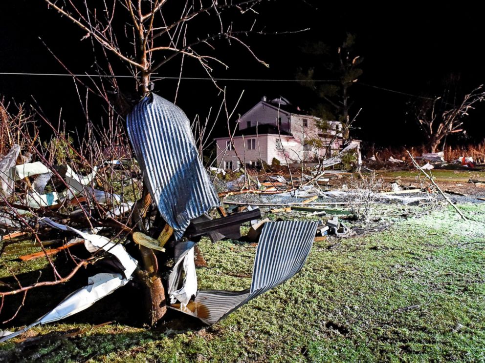 PHOTO:Debris from chicken houses that were leveled in a severe storm is strewn along Millwood Road in Gap, Pa., Feb. 24, 2016. The roof was blown off the house in the background.