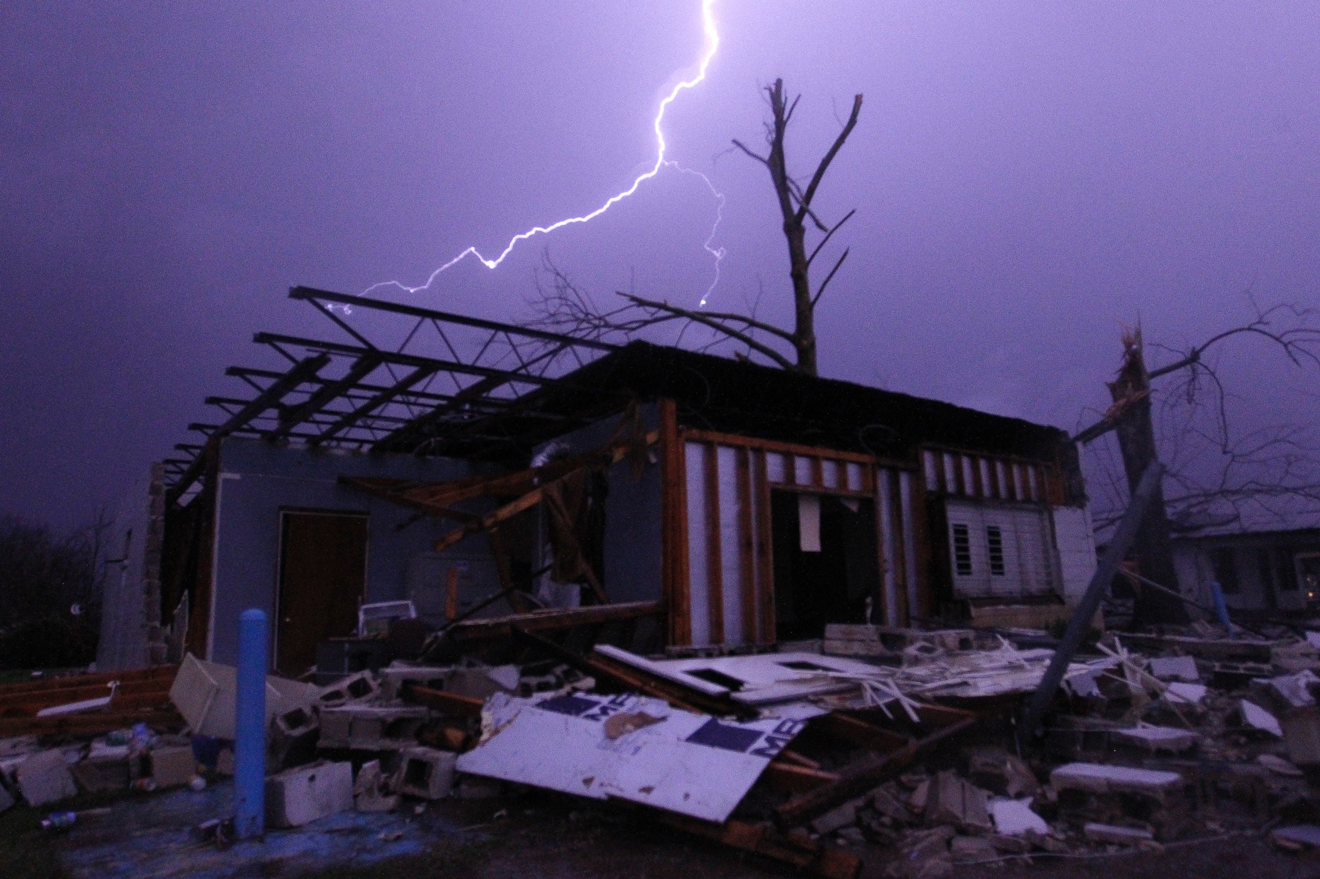PHOTO: Lightning illuminates a house after a tornado touched down in Jefferson County, Ala., damaging several houses, Friday, Dec. 25, 2015, in Birmingham, Ala. A Christmastime wave of severe weather continued Friday. 