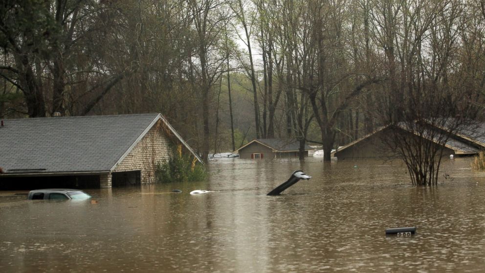 PHOTO: The lid of a car trunk and the top of a mailbox show how high flood waters have reached in the Tall Timbers subdivision of Haughton, La., March 9, 2016. 