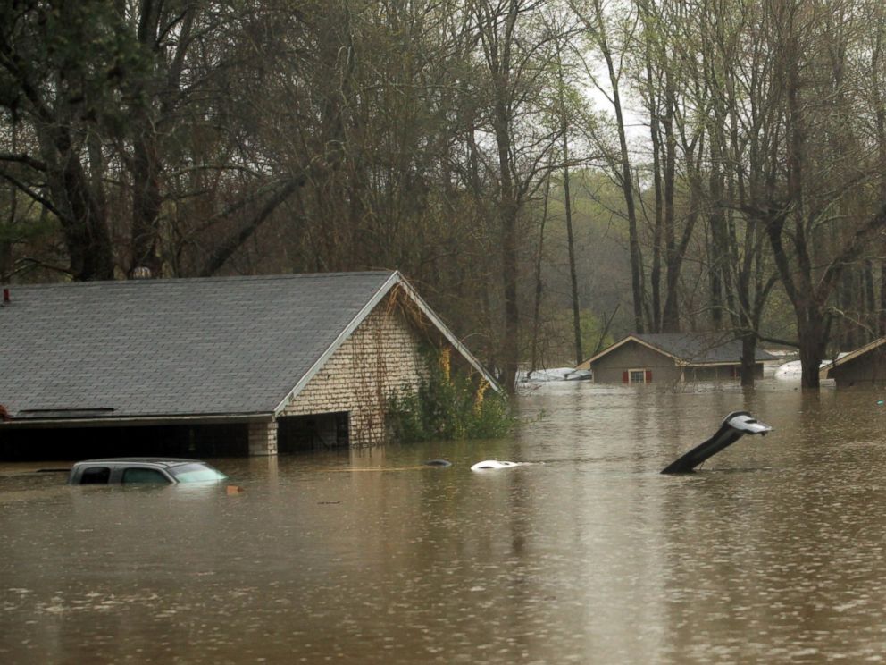 PHOTO: The lid of a car trunk and the top of a mailbox show how high flood waters have reached in the Tall Timbers subdivision of Haughton, La., March 9, 2016.