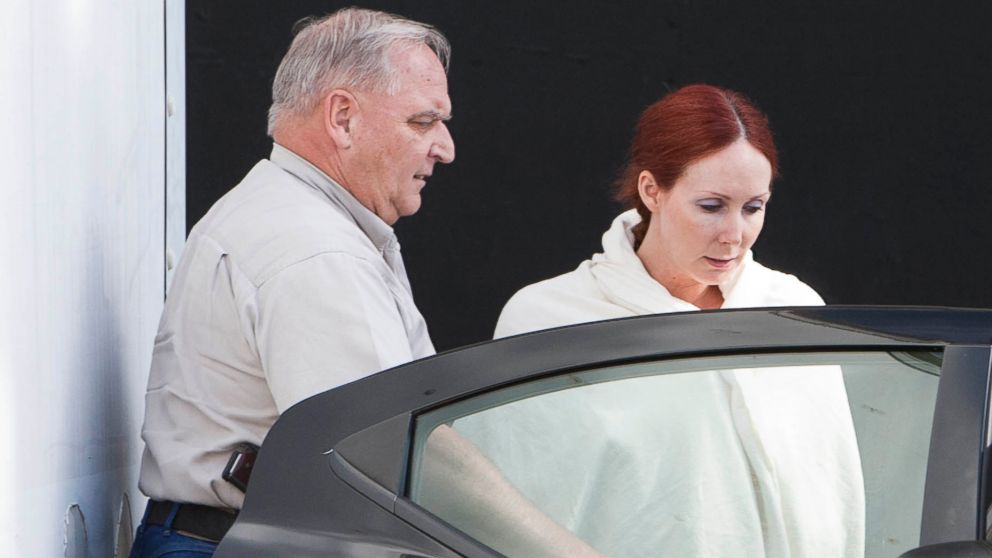 Shannon Richardson is placed into a Titus County Sheriff's car after an initial appearance at the federal building Texarkana, Texas, June 7, 2013.