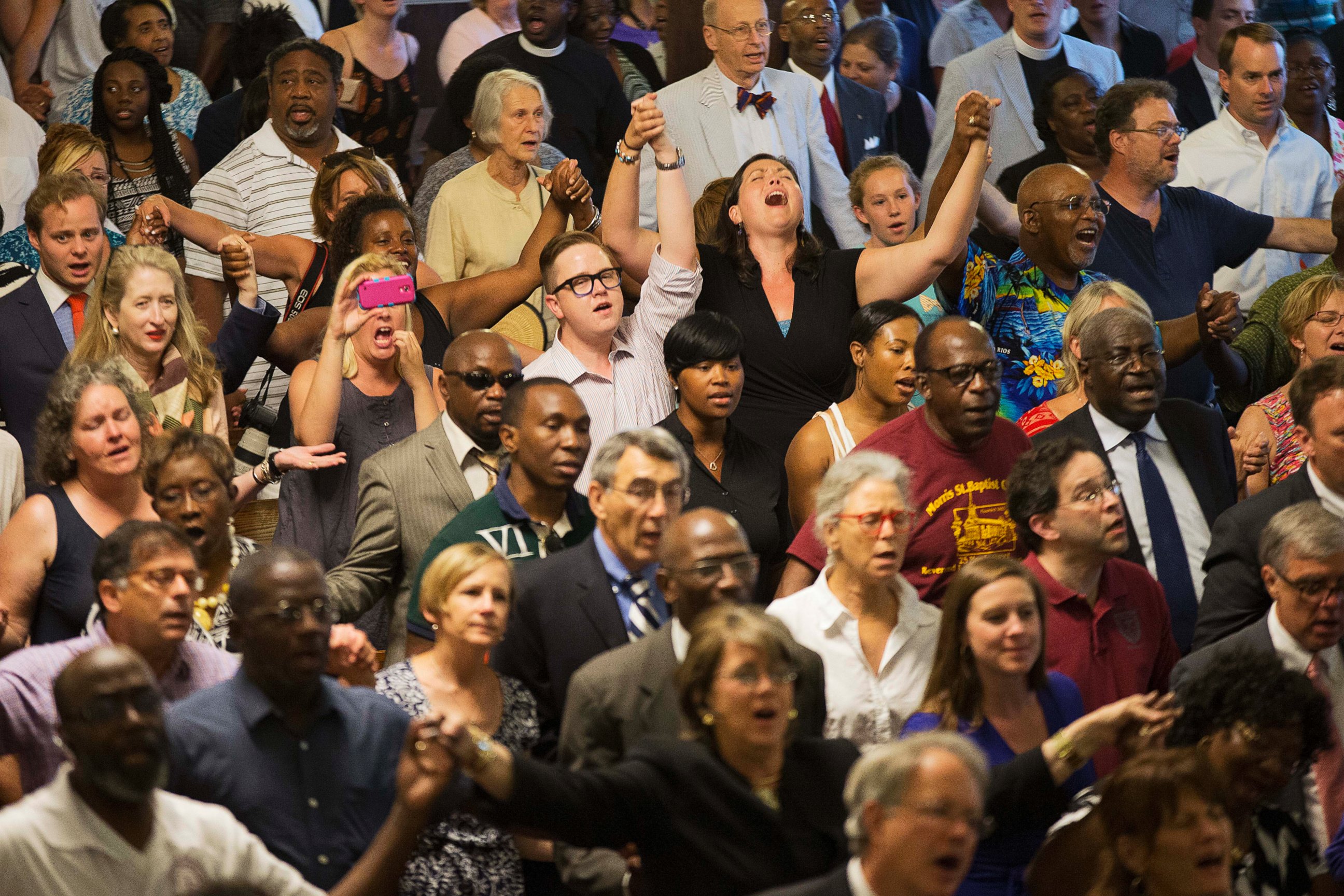 PHOTO: Parishioners applaud during a memorial service at Morris Brown AME Church for the people killed during a prayer meeting in Charleston, S.C.,  June 18, 2015.