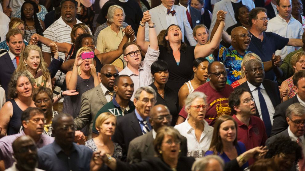 PHOTO: Parishioners applaud during a memorial service at Morris Brown AME Church for the people killed during a prayer meeting in Charleston, S.C.,  June 18, 2015.