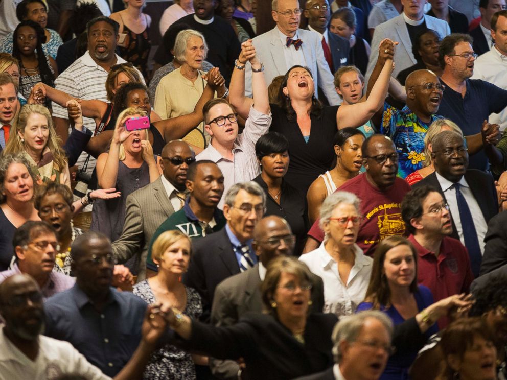 PHOTO: Parishioners applaud during a memorial service at Morris Brown AME Church for the people killed during a prayer meeting in Charleston, S.C., June 18, 2015.