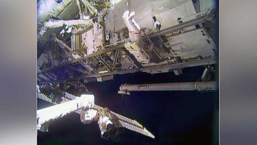 In this image made from video provided by NASA, astronaut Rick Mastracchio performs a space walk outside the International Space Station, Dec. 21, 2013. Mastracchio and Michael Hopkins ventured out of the station to try to revive a crippled cooling line.
