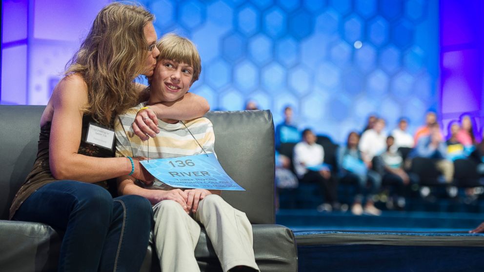 PHOTO: River Blount, 11, of Poplar Bluff, Missouri, is kissed by his mother Shannon Blount after misspelling the word 'fauces' during the semi-final round  of the 2015 Scripps National Spelling Bee in Oxon Hill, Maryland, May 28, 2015. 
