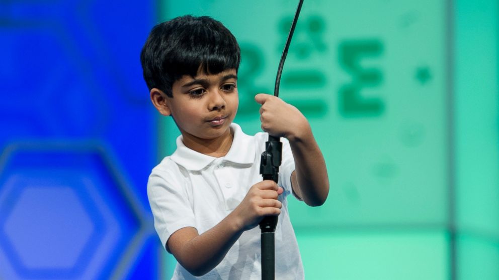 PHOTO: Akash Vukoti, 6, of San Angelo, Texas, tries to shorten the microphone before spelling his word during the preliminary round two of the Scripps National Spelling Bee in National Harbor, Md., May 25, 2016.