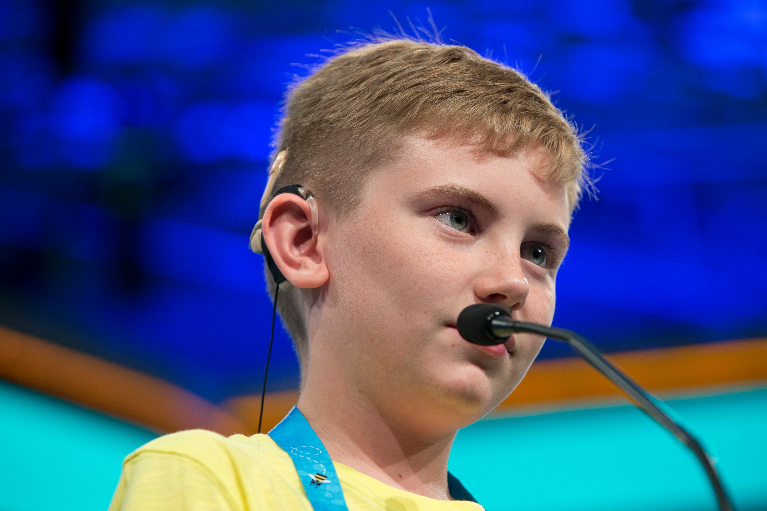 PHOTO: Neil Maes, 11, of Belton, S.C., who was born deaf and now hears with the helps of cochlear implants, competes during the preliminaries of the 2016 National Spelling Bee in National Harbor, Md., May 25, 2016. 