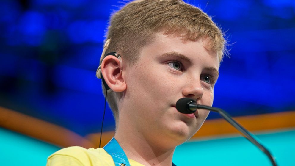 PHOTO: Neil Maes, 11, of Belton, S.C., who was born deaf and now hears with the helps of cochlear implants, competes during the preliminaries of the 2016 National Spelling Bee in National Harbor, Md., May 25, 2016.
