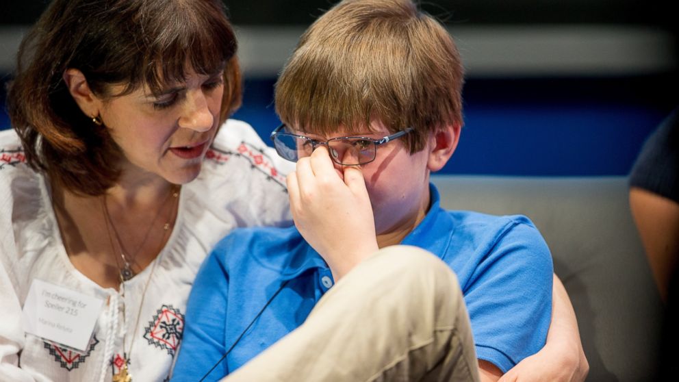 PHOTO: Christopher Relyea, 12, of Cumberland, R.I. is comforted by his mother Marina Relyea after incorrectly spelling "vexillology" during the preliminaries of the Scripps National Spelling Bee,, May 27, 2015, at National Harbor in Oxon Hill, Md. 