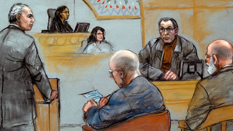 This courtroom sketch depicts Stephen "The Rifleman" Flemmi, upper right, on the witness stand as defendant James "Whitey" Bulger listens, seated middle, during Bulger's racketeering and murder trial at U.S. District Court in Boston, July 19, 2013.