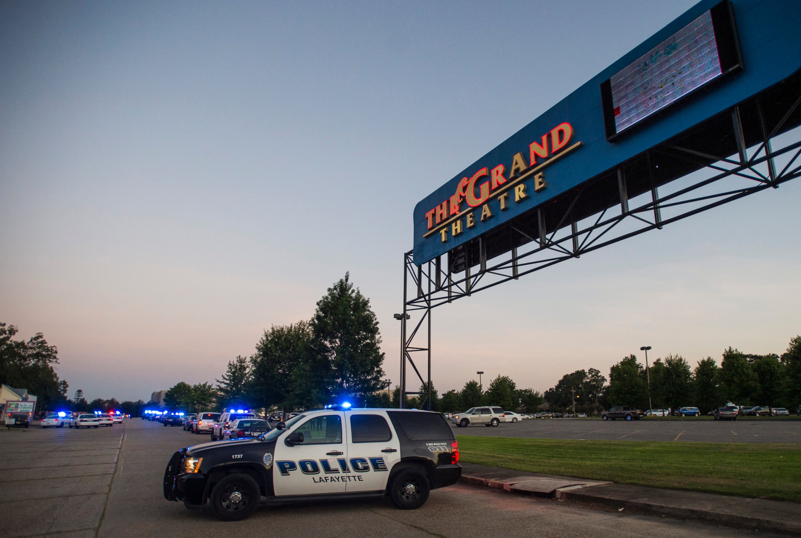 PHOTO: A Lafayette Police Department vehicle blocks an entrance at the Grand Theatre in Lafayette, La., following a shooting, Thursday, July 23, 2015.